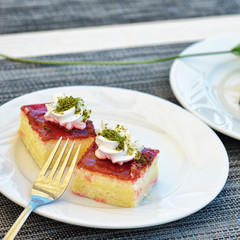 Tasty slices of cake on white plate