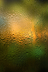 bright background with raindrops on window glass