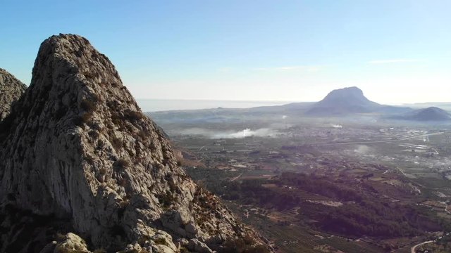 Aerial drone view of Segaria mountain, in Marina Alta, Alicante, Spain. Denia and Montg&oacute; mountain are in the background