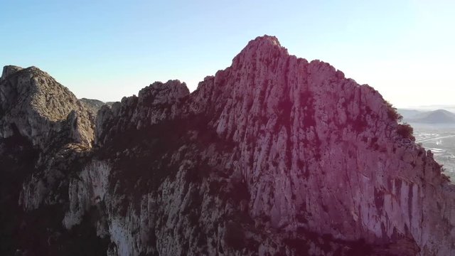 Aerial drone view of Segaria mountain, in Marina Alta, Alicante, Spain. Denia and Montg&oacute; mountain are in the background