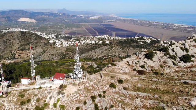 Aerial drone view of telecommunication antennas in Segaria mountain, in Marina Alta, Alicante, Spain