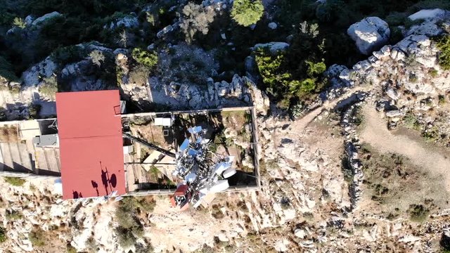 Aerial drone view of telecommunication antennas in Segaria mountain, in Marina Alta, Alicante, Spain