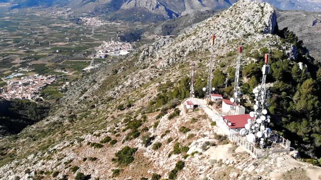 Aerial drone view of telecommunication antennas in Segaria mountain, in Marina Alta, Alicante, Spain