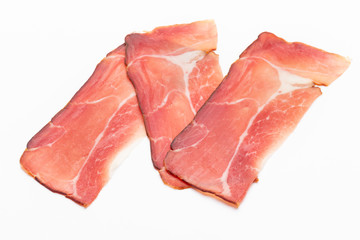 Hamon sliced on white background. Spanisch traditional meat.