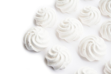 Small white meringues  isolated on white background