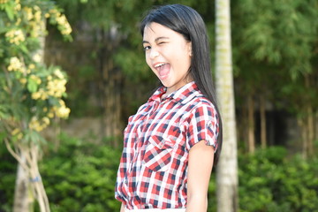 Fototapeta premium A Winking Minority Girl