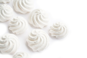 Small white meringues  isolated on white background