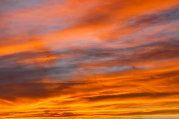 Colorful red sunset over the Sahara desert, the sky at sunset with red clouds, Morocco