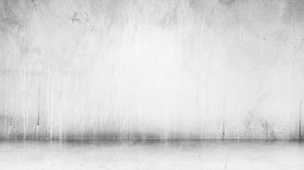Cement wall with floor in the empty room and light for background.