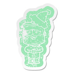 cartoon distressed sticker of a robot wearing santa hat