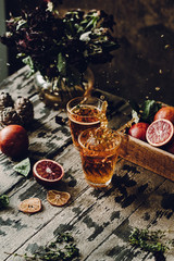 Refreshing Orange drink on a dark wooden background
