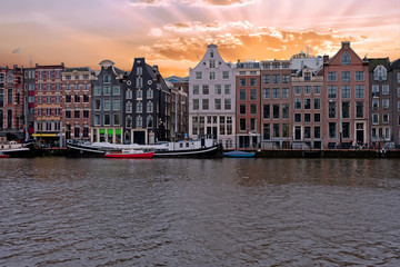 Naklejka premium Medieval houses along the river Amstel in Amsterdam Netherlands