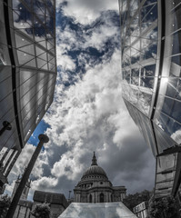 dome of st pauls cathedral with reflections on nearby windows
