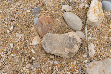 Pebbles withcoarse sand lying on a beach