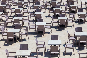Many plastic tables with chairs. Top and perspective view.