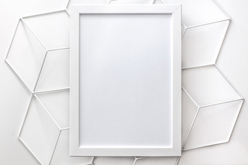 White empty frame with space for your graphic on a white background in a geometric pattern. Mockup. White on white. High key.