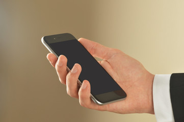 Male hand holding smart phone with clipping path