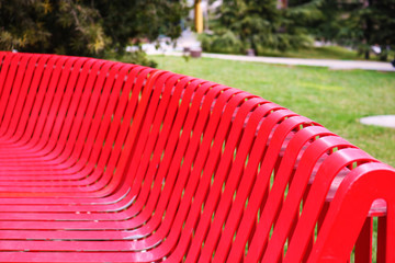 Obraz premium Red iron park bench
