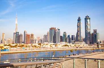 Dubai, UAE - FEBRUARY 2018:Dubai Downtown skyscrapers and Burj Khalifa as viewed from the Dubai water canal