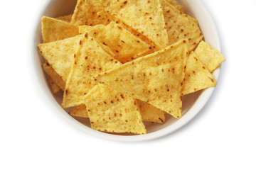 Corn Totillas chips in a bowl isolated on white background. Mexican food also called Nachos