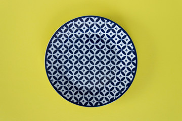 Abstract top view  of modern blue plate on colorful background