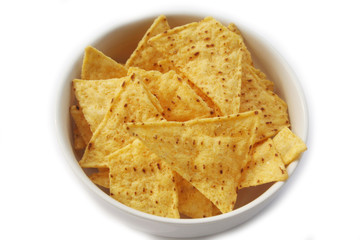 Corn Totillas chips in a bowl isolated on white background. Mexican food also called Nachos