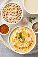Hummus bowl and raw ingredients for cooking.