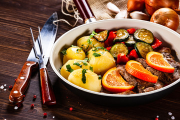 Grilled steak, boiled potatoes and vegetables