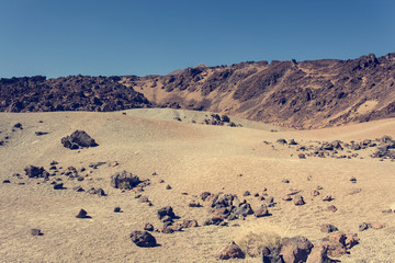 Spectacular volcanic landscape in desert environment with wicked lava shapes.