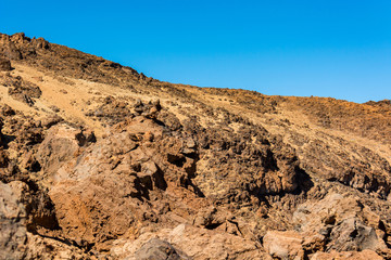 Spectacular volcanic landscape in desert environment with wicked lava shapes.