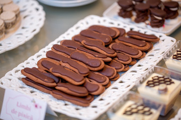 Table with delicious candy, cupcakes, cakepops, macaroons and other sweets