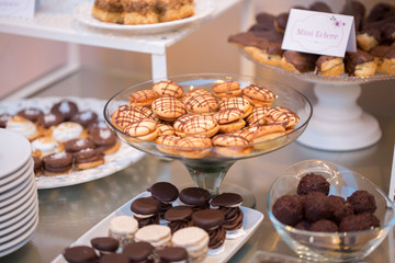Table with delicious candy, cupcakes, cakepops, macaroons and other sweets