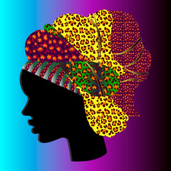 Silhouette of an African woman in a massive headdress. Leopard print.