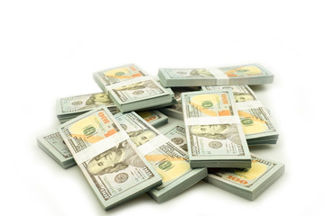 Stack bundles of 100 US dollars banknotes on white background