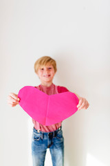 Portrait of a young boy wearing pink