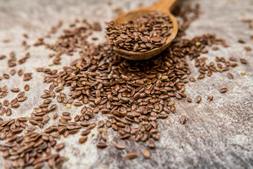 Flax seeds wooden spoon scattered carelessly menu ingredient