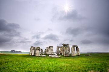 Sun peaking through the stormy clouds, Stonehenge, England