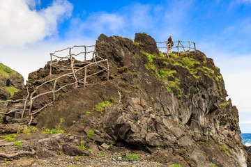 Fototapeta na wymiar Beautiful viewpoint on a hiking path on the north coast of Madeira at Seixal, on a summer day with blue sky