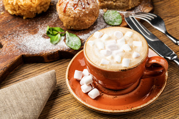 drink hot chocolate and marshmallows. marshmallows next to attributes