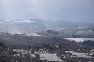 The Chianti landscape in the Tuscan hills after a winter snowfall. Chianti, Tuscany, Italy