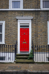 Fototapeta na wymiar red door of house