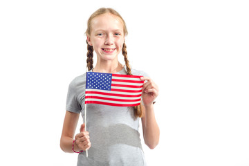 Portrait of a teenager girl with the flag of the United States of America on white background. American people. Learn English.