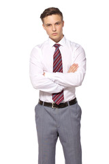 Young businessman isolated - handsome man standing with crossed arms