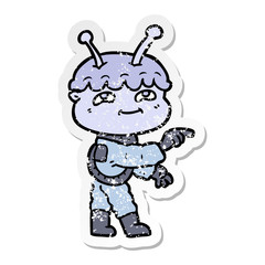 distressed sticker of a friendly cartoon spaceman pointing