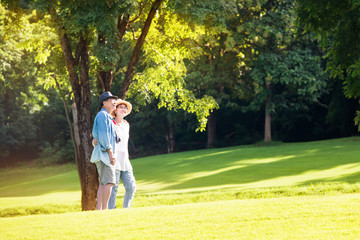 Image of happy romantic Asian senior couple outdoor in park