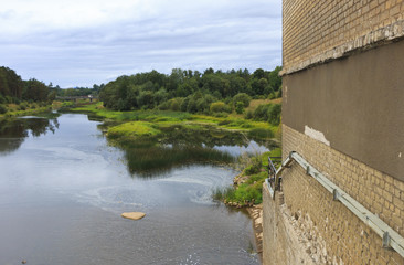 Naklejka premium Embankment of hydroelectric power on the river.