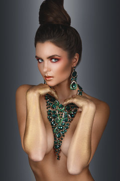 Sexy woman wearing big beautiful necklace with a lot of gems