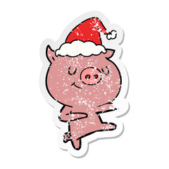 happy distressed sticker cartoon of a pig dancing wearing santa hat