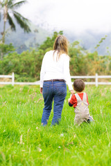 Fototapeta premium Lovely mother and boy walking outdoors