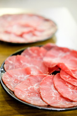 Sliced meat on a plate ready for Sukiyaki or Shabu shabu